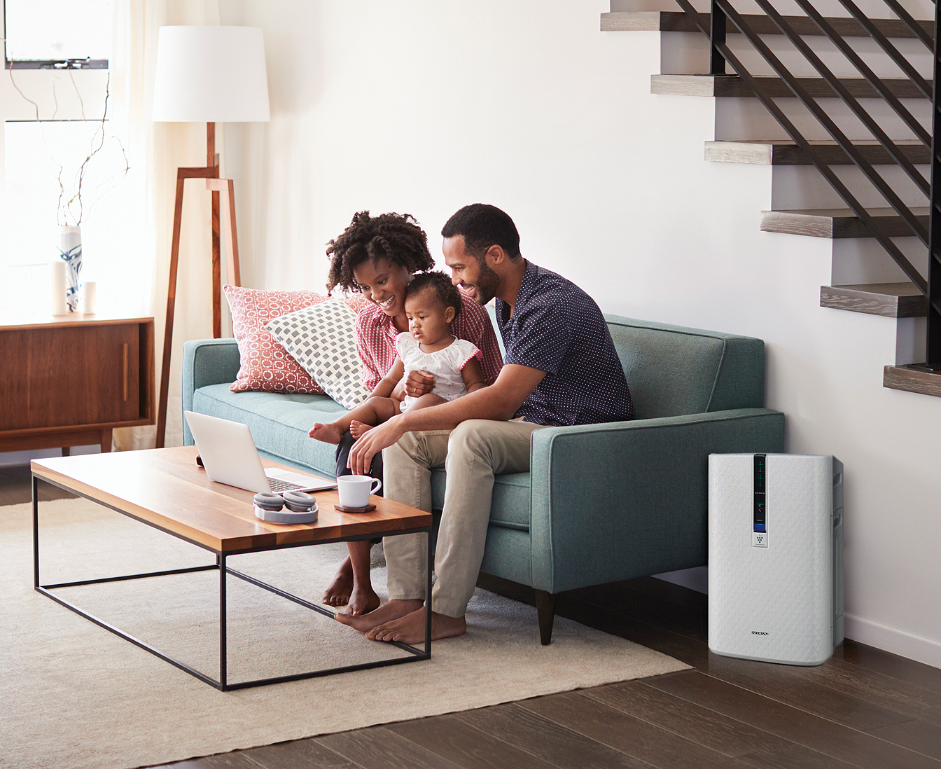Family in living room with KC850U air purifier