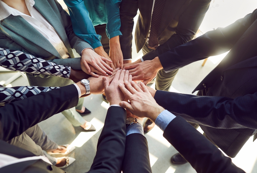 hands gathered in a circle
