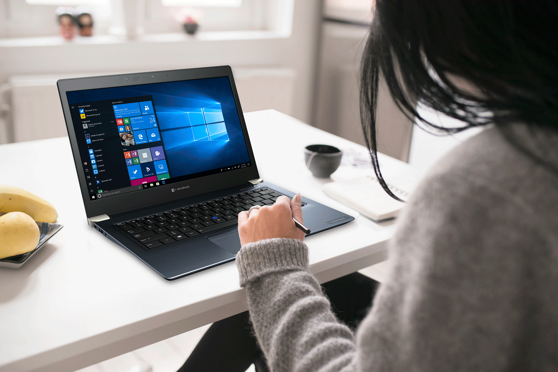 female on a laptop at her desk